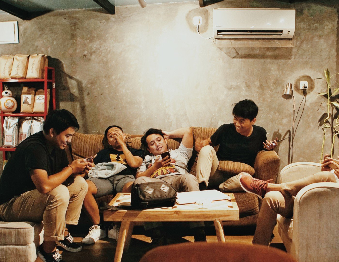 A group of guys chilling in a house