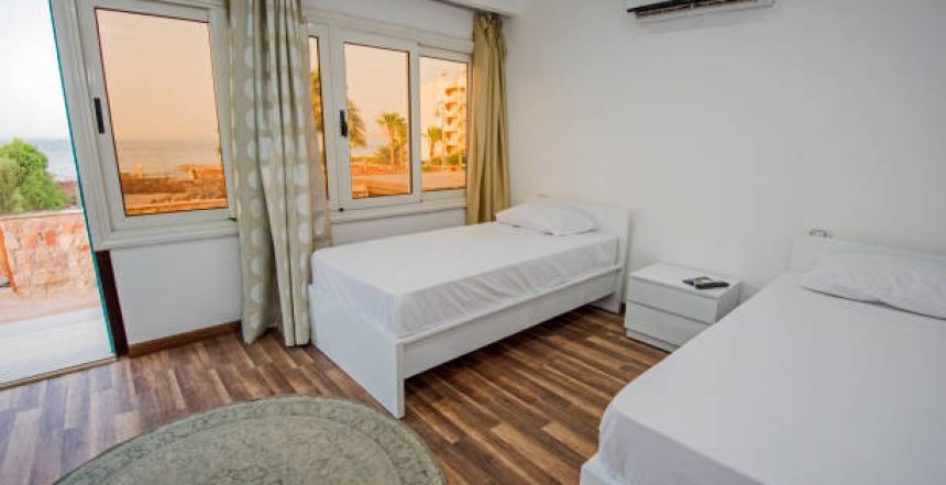 Twin beds in bedroom of luxury hotel room apartment